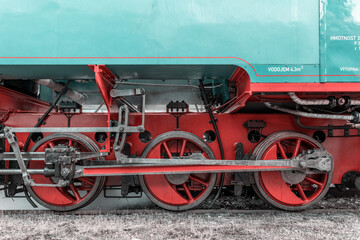 Steam train wheels and connecting rods revealing vintage transport technology