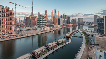 Fototapeta premium The rhythm of the city of Dubai from night to morning aerial timelapse