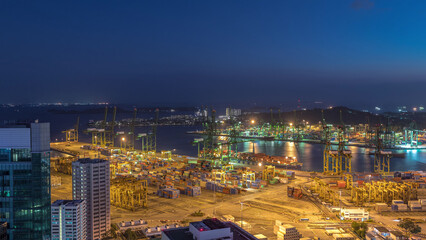 Fototapeta premium Commercial port of Singapore aerial day to night timelapse.