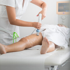 Professional aesthetic treatment on woman’s legs in beauty clinic