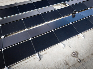 Photovoltaic Solar Panel Installation on Industrial Flat Roof for Sustainable Energy Production