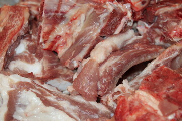 Fresh cuts of pork ribs ready for preparation in a butcher shop