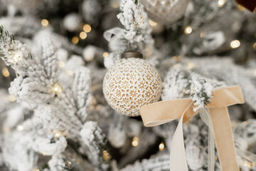 Beautiful festive decorations on the Christmas tree. Close-up. Beautiful Christmas background. The concept of decorations and decor for the new year