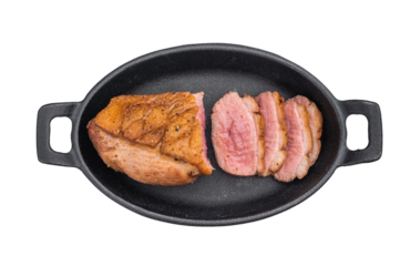 Golden seared duck breast with juicy pink center displayed on white surface great for gourmet cooking photography and food styling.