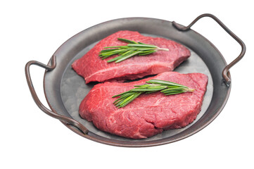 Marbled Wagyu beef top blade chuck similar to angus and yakiniku cuts displayed on round iron skillet with rosemary on clean backdrop great for butcher content.