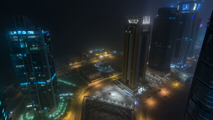 Fototapeta premium The skyline of the West Bay area from top in Doha day to night timelapse, Qatar.