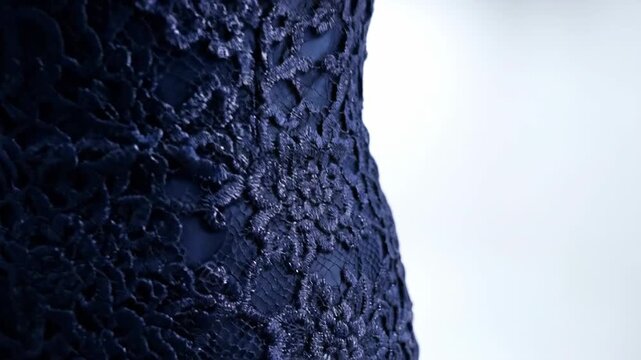 Elegant lace evening gown displayed on mannequin
