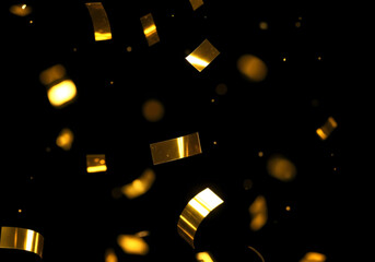 キラキラと舞い落ちるメタリックなコンフェッティの背景素材　金色の紙吹雪