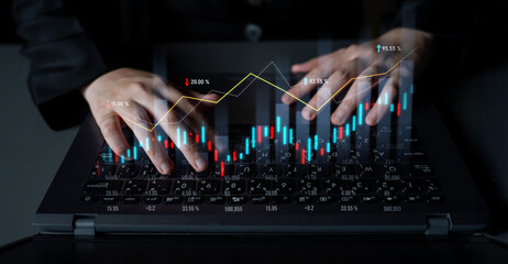 A business professional engages in stock market analysis using a laptop, with hands positioned over the keyboard and financial graphs displaying trends and data. Scalp