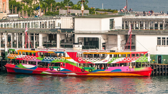 Star Ferries and other ships are sailing through Victoria Harbour timelapse hyperlapse, with the skyline of Hong Kong as backdrop