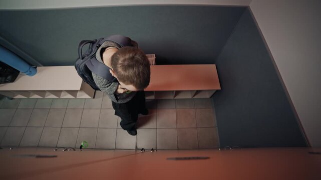 Shot of adaptive fitness in action. An athlete with a limb difference works on lower body strength using a leg press machine, assisted by a personal trainer. Highlights accessibility and determination