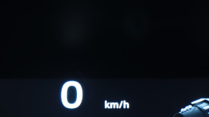 Turning on the electric car dashboard. The car dashboard when starting the engine in the dark. The electric car dashboard with backlight.