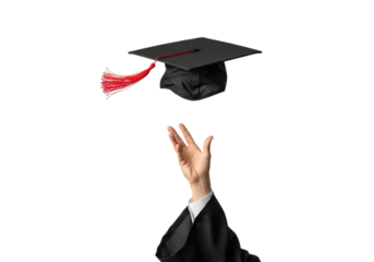 Graduate's hand throws academic cap with red tassel up in air