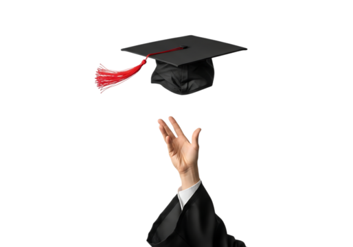 Graduate's hand throws academic cap with red tassel up in air
