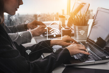 A dynamic modern workspace showcasing individuals using laptops amidst wireless signals, symbolizing remote work and digital connectivity in a vibrant office with a city skyline. Gantry