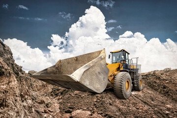 A bulldozer moves earth at a construction site, showcasing its powerful stance against a backdrop...