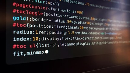 A close-up view of colorful code displayed on a screen, highlighting CSS styling elements during software development - Powered by Adobe