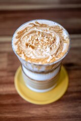 Peanut Cream Latte with Whipped Foam and Nut Toppings
