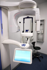 Modern panoramic dental X ray machine diagnostics in dentistry. CBCT Cone Beam Computed Tomography medical technique uses cone shaped X ray beam to create 3D images of teeth, jaw, nerves and sinuses.