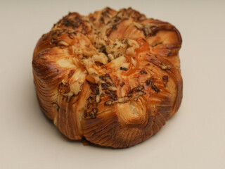 Danish pastry with savory filling on white background