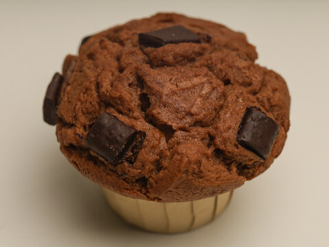 Chocolate muffin with dark chocolate on top  - Powered by Adobe