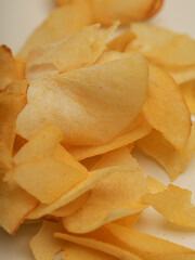 Cassava chips piled on white background