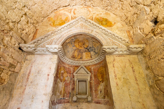 Early medieval frescoes adorning Tempietto del Clitunno interior