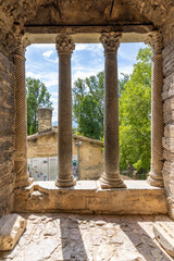 Fototapeta premium Ancient columns framing view of Tempietto sul Clitunno, Umbria