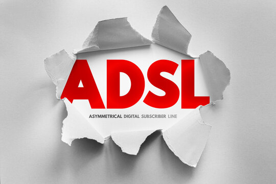 ADSL acronym for Asymmetrical Digital Subscriber Line revealed through torn paper, representing broadband internet, high-speed data, telephone line usage, DSL technology, and online access