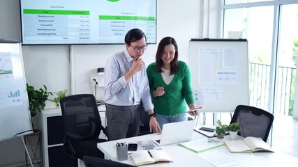 Asian adult business professionals analyze financial data digital assets laptop tablet office strategy planning analytics collaboration modern workplace - Powered by Adobe