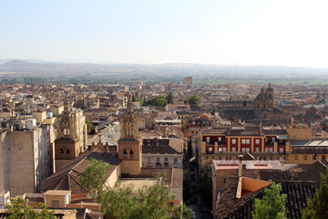 Fototapeta premium Hilltop view of Granada cathedral under renovation, photographed in July 2024.