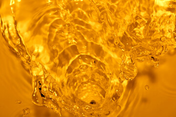 The surface of the water splashes orange.