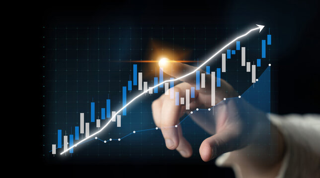 A hand is reaching towards a financial graph displaying rising trends with candlestick charts and a white trend line, symbolizing growth and future opportunities. Impute