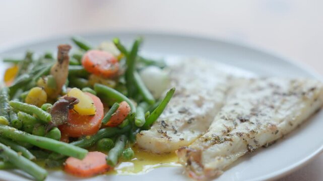 Baked Cod Fish Fillet Served with Steamed Green Vegetables