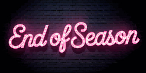 Illuminated End of Season Neon Sign on Brick Wall Inviting Shoppers to Sales Event with Pink Glow