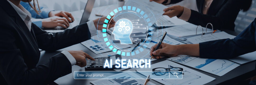 Business professionals engaged in a collaborative meeting focused on AI search technology, analyzing data through laptops and documents in a modern office environment Trope.