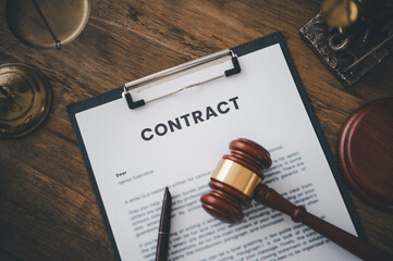Judge's Hammer and Legal Book on Table - Symbolizing Contract Agreements and Courtroom Proceedings,Law and Justice Concept