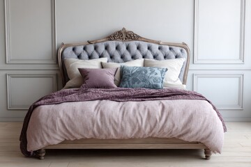 Plush tufted headboard bed with decorative pillows and blanket.