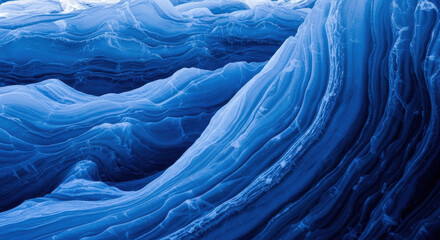 Abstract blue ice formations with layered textures.