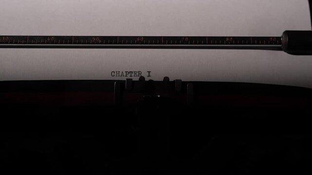 Vintage typewriter detailing a close up on paper, typing chapter i to mark the beginning of a story, novel, or creative writing project, symbolizing new starts and storytelling
