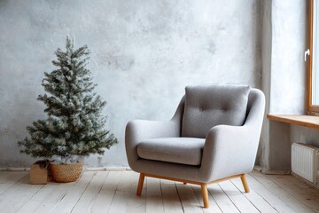 Fototapeta premium Modern grey armchair and small artificial tree sit on white floor.