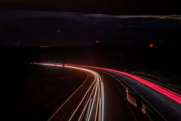Color cars lines on dark highway from Prague to Linz near Chotycany village