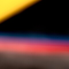 Abstract Light Leaks and Color Gradient on Black Background