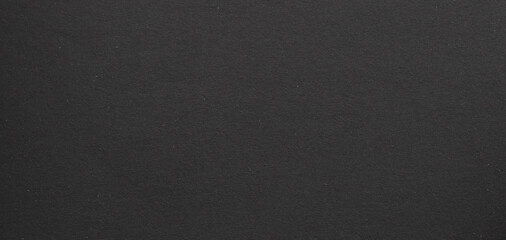 Fototapeta premium deep charcoal background with a smooth matte texture and a soft, uniform surface..