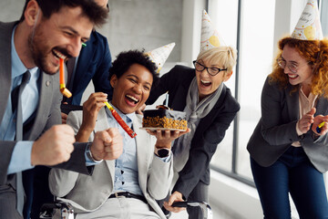 Business People Celebrating a Colleague's Birthday in the Office.