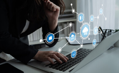 A professional woman engages in data analysis using a laptop, surrounded by digital connections symbolizing technology trends in a modern office setting. Tessel