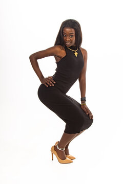 Confident Fashion Model Posing in Stylish Black Dress