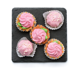 Top view of mini cakes on slate plate