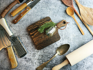 Christmas cooking utensils on table. Top view with cutting board, copy space for your text