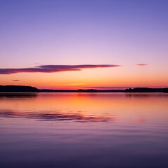 Obraz premium Majestic twilight hues paint the horizon, with a tranquil lake reflecting the serene purple and orange sky